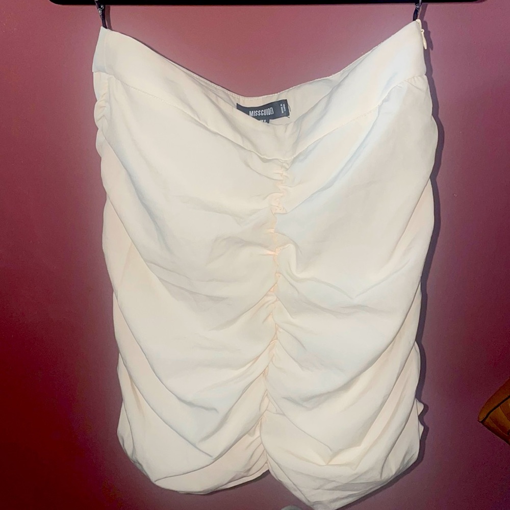 Misguided brand cream, ruched, mini skirt.